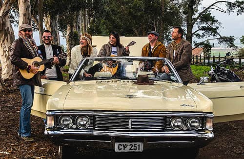 Cadillac Tours And Trips People Playing Guitars In Convertable Cadillac