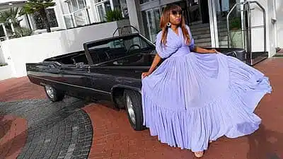 Chauffeur Rentals For Matric Balls African Women In Purple Dress Sitting On Convertable Cadillac