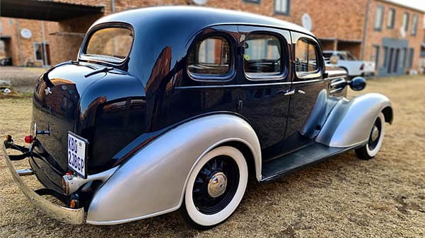 cape corporate tours classic car chauffeur drives blue and silver classic forties chevrolet