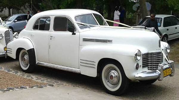 cape corporate tours classic car chauffeur drives white vintage forties car