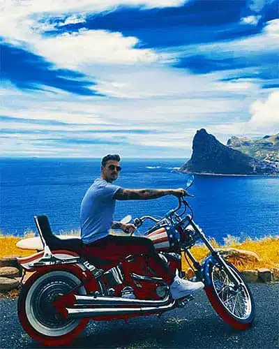 cape corporate tours harley davidson rentals guy sitting on custom harley