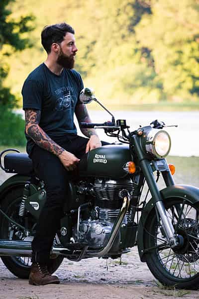 cape corporate tours royal enfield motorcycle rentals trendy guy sitting on royal enfield motorbike