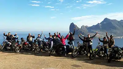 Cape corporate tours harley davidson chauffeur rides goup of people on harleys hout bay